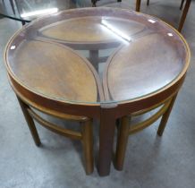 A Nathan Trinity teak and glass topped circular nest of tables