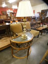 A bamboo demi lune hall table and a brass table lamp