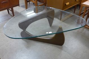 An Isamu Noguchi style beech and glass topped coffee table