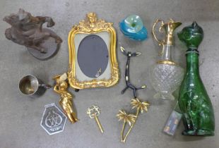 A cast metal model of a rearing horse, gilt picture frame, glass model of a cat, a gilt and glass