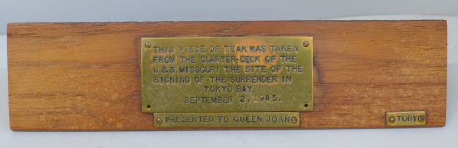 A piece of teak, taken from the Quarter-Deck of the USS Missouri, the site of the signing of the