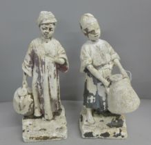 A pair of plaster garden figures, 34cm