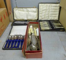 A collection of boxed flatware