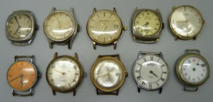 Ten wind-up mechanical wristwatch heads