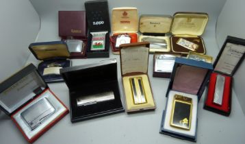 Thirteen boxed lighters, including Zippo with Wales flag and several Ronson