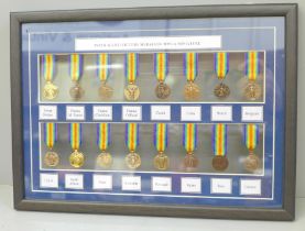 A framed collection of WWI miniature medals