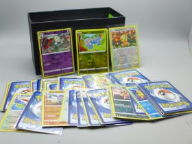 220 Holographic Pokemon cards in protective sleeves