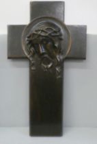 A crucifix with 'bronzed' finish, 34.5cm wide