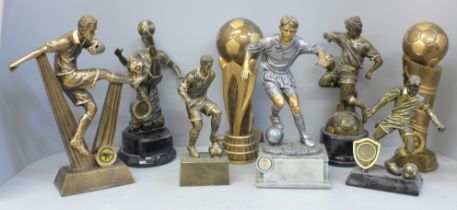 Eight large football trophies including six footballers in action