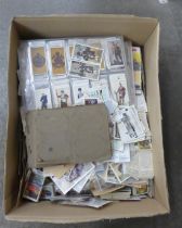 Cigarette cards; cigarette and trade cards in albums, on pages and loose