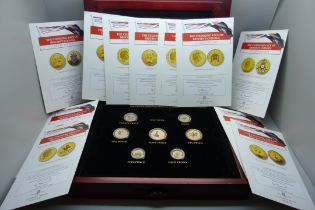A cased set of decimal and pre-decimal gold plated coins
