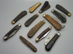 Twelve penknives, some with antler handles