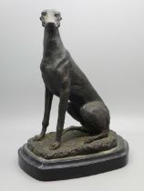 A model of a lurcher on a marble plinth, 19cm