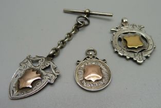 Three silver fob medals with applied gold, including Chester 1903, (metal chain and T-bar)