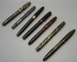 Seven fountain pens, five with 14ct gold nibs, one lacking clip