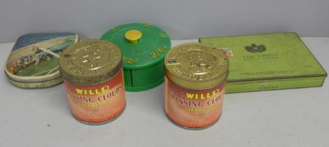 Three cigarette tins one other tin and a money box