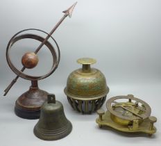 A prayer bell, another bell, a modern sextant and an armillary sphere