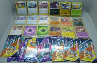 54 Tournament Pokemon cards, Trom Pacts Series 1 & 2, including 18 Holos, with nine empty packets
