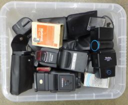 A collection of camera flash guns including Hanimex, Vivitar and Pentax