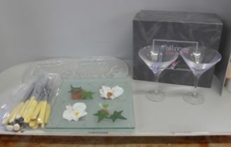 A glass oblong display plate with two sheep, a glass table decoration, fish knives and forks and
