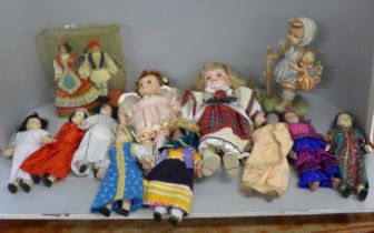 A collection of dolls including many from different countries