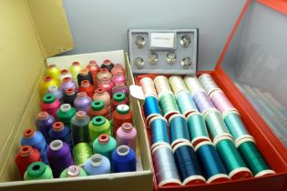 A collection of 57 multi-coloured reels of hobbyist embroidery thread and a set of novelty top hat