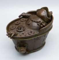 A novelty bronze incense stick holder, a bathing toad