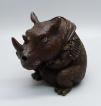 A bronze rhinoceros incense stick holder
