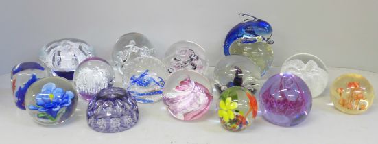 Fourteen glass paperweights including Caithness and Selkirk, and one other paperweight