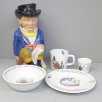 Four pieces of Wedgwood nursery china and a John Bull Toby jug with lid
