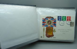 An album with First Day Covers, Mint stamps, four 10 shillings notes, a £1 note and one other Ten