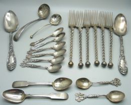 Four silver spoons, 64g, and a collection of plated flatware