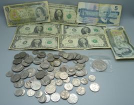 A collection of US and Canada coins and banknotes