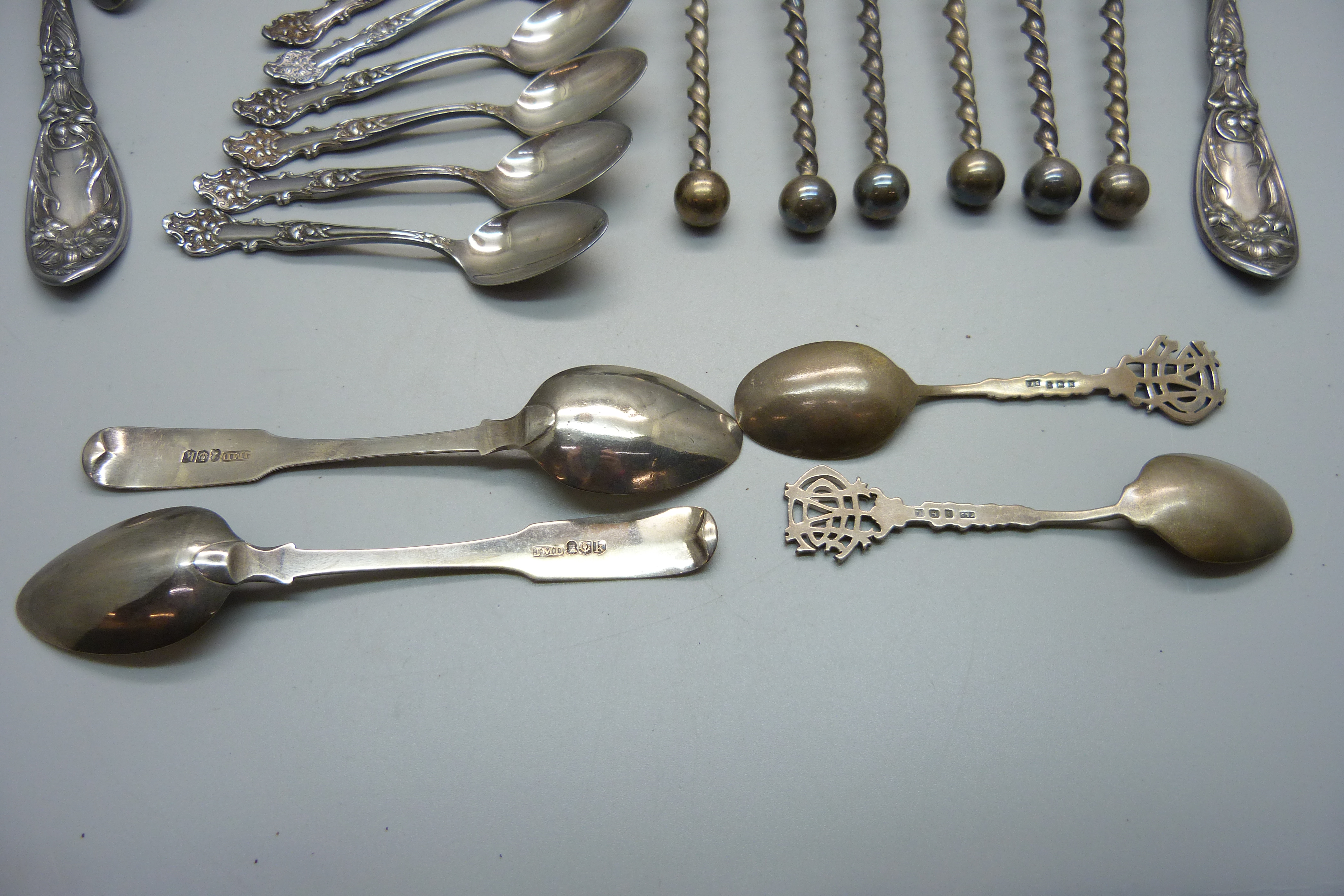 Four silver spoons, 64g, and a collection of plated flatware - Image 3 of 4