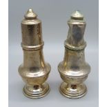 A silver salt and pepper pair, salt a/f, silver approximately 68g