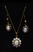 A 9ct gold and opal pendant on chain and a pair of opal earrings, 3.5g, one opal earring chipped