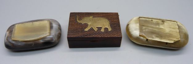 Three snuff boxes, two horn and one wood with brass elephant detail