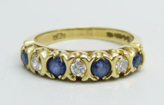 An 18ct gold, seven stone sapphire and diamond ring, 3.7g, L/M