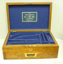 A John Wilkes Gun and Rifle Maker accessory box with lower drawer