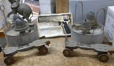 A G.10 BB air pistol, (located in silver cabinet) two paraffin lamps and a pair of roller skates **