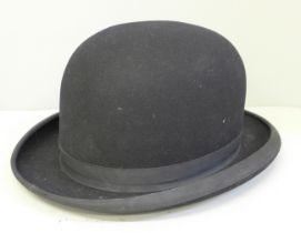 A bowler hat, inner lining loose, a/f