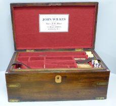 A John Wilkes Gun and Rifle Maker mahogany accessory box, with two internal trays, gaming