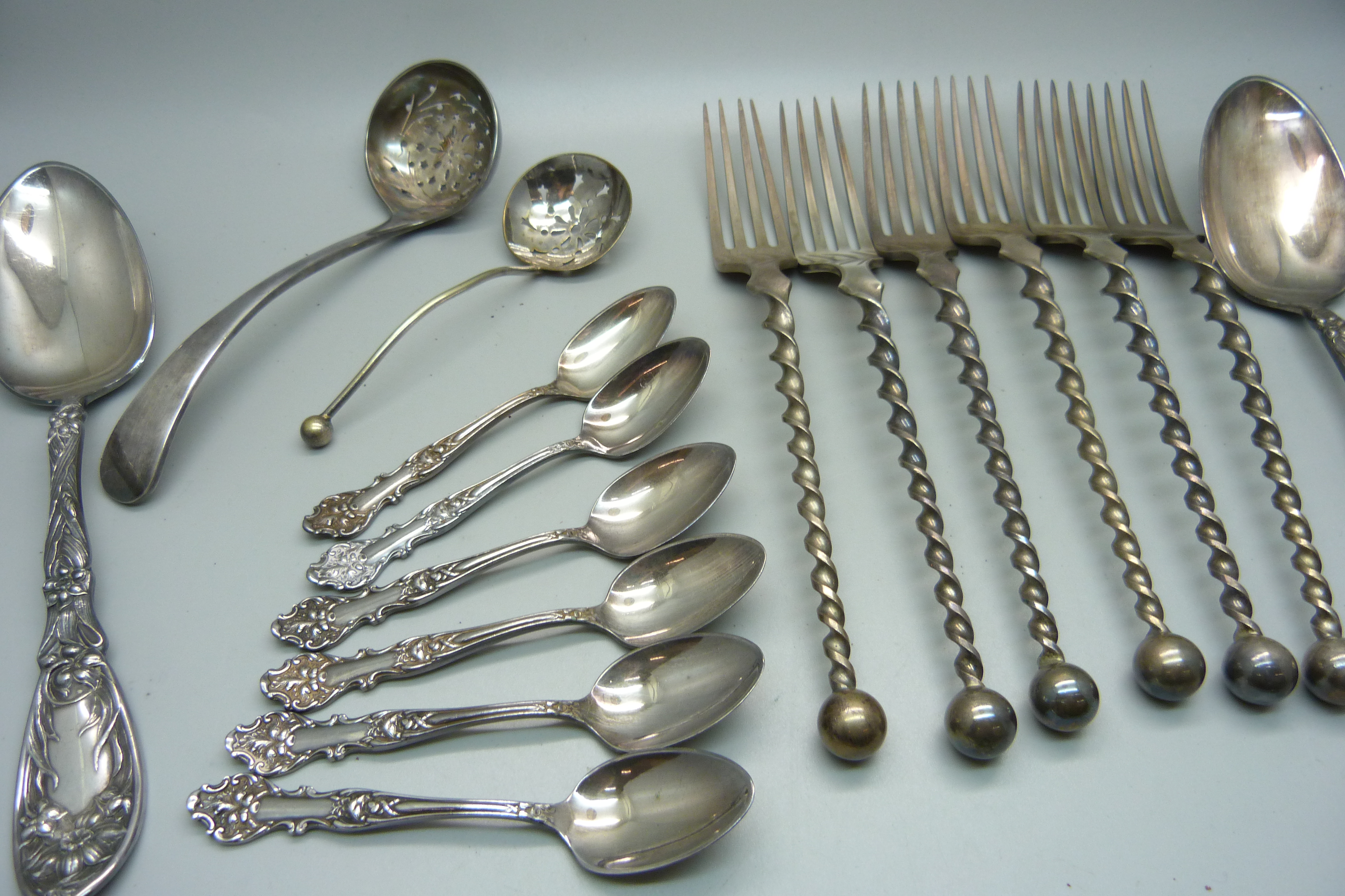 Four silver spoons, 64g, and a collection of plated flatware - Image 4 of 4