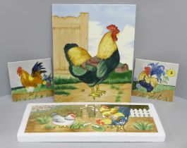 A large rooster tile, rectangular farmyard tile and two small square rooster tiles