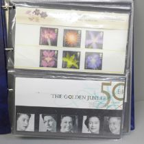 Stamps; an album of GB presentation packs (36)