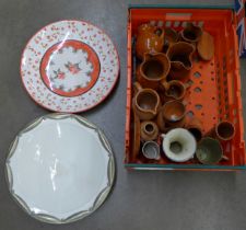 A collection of terracotta jugs, other china including a vase, two chargers, Bourne Daisy jug,
