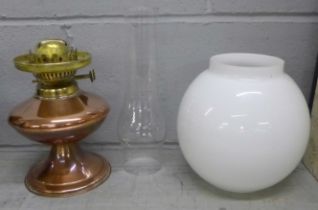 A brass oil lamp **PLEASE NOTE THIS LOT IS NOT ELIGIBLE FOR POSTING AND PACKING**