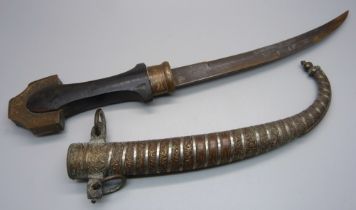 An eastern dagger and scabbard, 41cm with scabbard on