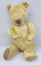 A 1940s Teddy bear, jointed limbs, lacking eyes, 42cm