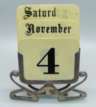 A silver Art Nouveau perpetual calendar, London 1930, 9cm wide at the base